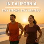This is an image of a man runing in with a woman in a beach with the sun rising behind them. On the image is a caption Thanksgiving Fitness Tips in California Stay Strong, Stay Grateful.